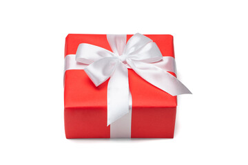 Close up shot of gift box wrapped in red paper and decorated with satin ribbon bow, isolated on white background