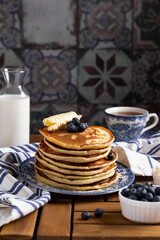 Pancakes with blueberry on a wooden table