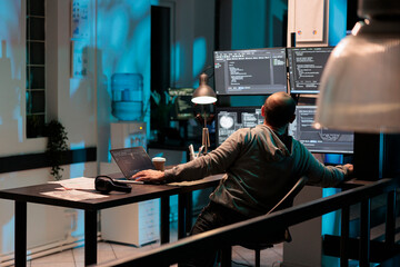 Software developer typing programming code on computer with multiple monitors, working with html script. Developing algorithms for artificial intelligence on terminal window, cloud computing.