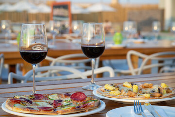 Typical peruvian food and drinks, pizza on the beach