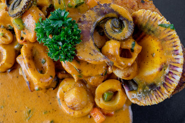 Typical peruvian food and drinks, tacu tacu with octopus