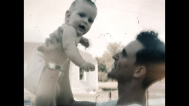 Father and Baby 1951 - A father holds his baby in Chicago, Illinois in 1951. 