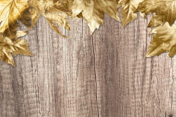 Autumn dry fall golden leaves on the desk