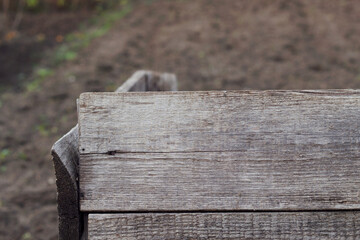 old wooden box plank in the garden as an empty background