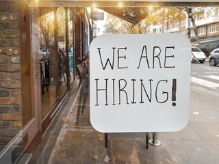 Showcase of street cafe with inscription we are hiring ,inding job concept