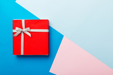 holiday handmade present tied gray ribbon bow top view with copy space. Flat lay holiday background. Birthday or christmas present. Christmas gift box concept with copy space