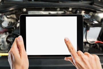 Mechanic worker with digital tablet on car background