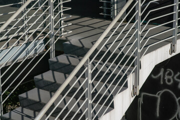 staircase architecture: detail of the external access stairs to the floors, with concrete steps,...