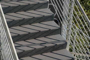staircase architecture: detail of the external access stairs to the floors, with concrete steps,...