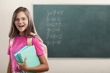 Smiling happy female student in classroom