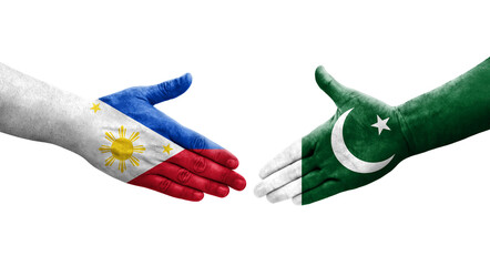 Handshake between Pakistan and Philippines flags painted on hands, isolated transparent image.