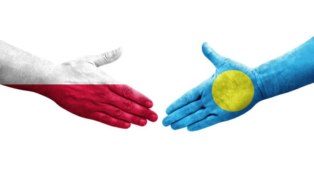 Handshake between Palau and Poland flags painted on hands, isolated transparent image.