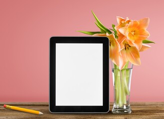 Digital tablet with blank screen on office desk