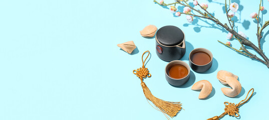 Chinese symbols on light blue background with space for text. New Year celebration