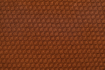 Closeup view of brown fabric with pattern as background