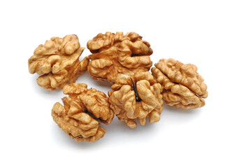 Heap of fresh walnut kernels on white background