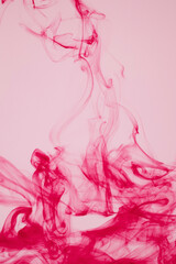 Fototapeta premium red ink dissolving in water