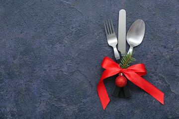 Stylish table setting for Christmas celebration on dark background