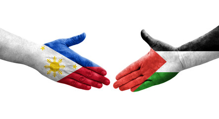 Handshake between Palestine and Philippines flags painted on hands, isolated transparent image.