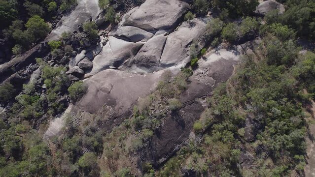 Big Granite Boulders And Tropical Vegetation At Granite Gorge Nature Park In Mareeba, QLD, Australia - aerial drone shot