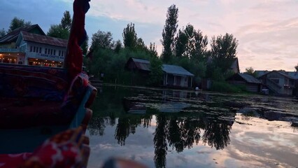 View Of Dal Lake From Shikara Boat Sailing At Sunset. Urban Lake In Srinagar, Jammu and Kashmir, India. POV