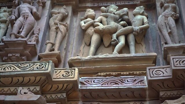 Famous Erotic Arts On The Wall of Khajuraho Temples In Chhatarpur, Madhya Pradesh, India. - tilt up