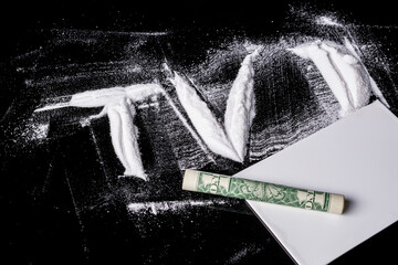 1 US dollar bill, rolled into a tube, on white powder in the form of the letters TV. Conceptual idea of fakes, lies on television, in the media.