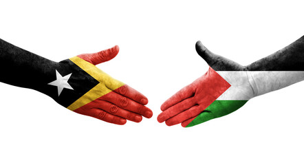 Handshake between Palestine and Timor Leste flags painted on hands, isolated transparent image.
