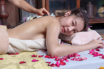 Professional masseur doing therapeutic massage. Woman enjoying massage  Young woman getting relaxing body massage beauty spa center body care, skin care, wellness, wellness, beauty treatment concept