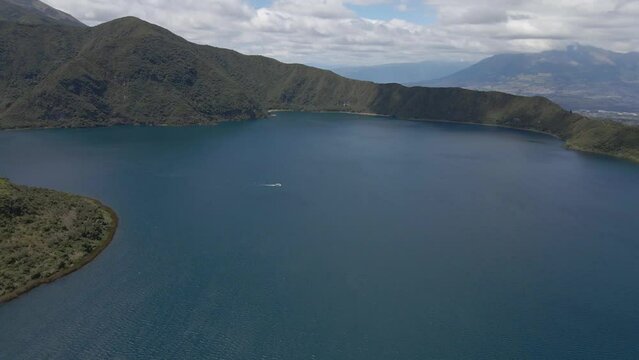 Cuicocha Lake, big lake around mountains, aerial shot of lake and volcano