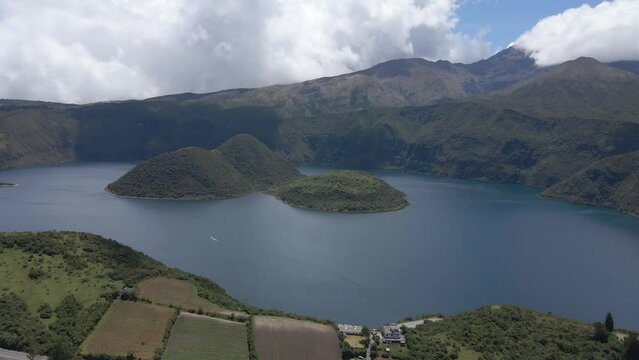 Cuicocha Lake, big lake around mountains, aerial shot of lake and volcano