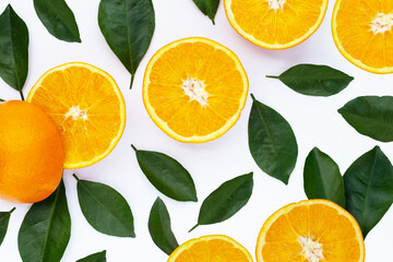 Orange fruit with green leaves on white background.