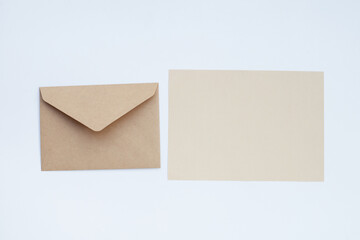 Brown paper and envelopes on white background.