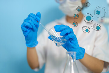 Modern medical research laboratories Beautiful female scientist wearing protective goggles mixes chemicals in test tubes in laboratory biochemical samples, an advanced science laboratory for medicine.