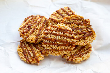 Rice cracker with coconut palm sugar on white