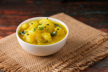 Traditional Punjabi potato curry, an appetising vegetarian meal side dish for poori chapatti roti rice.