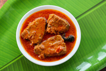 Kerala fish curry Alappuzha, India, Hot and spicy homemade red fish Masala curry banana leaf...