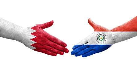 Handshake between Paraguay and Bahrain flags painted on hands, isolated transparent image.