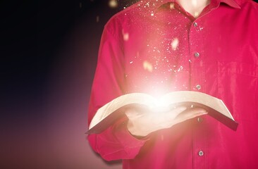 Wooden desk with bible book and light