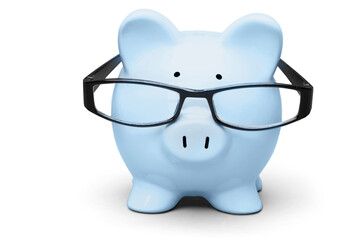 Blue piggy bank in glasses on background