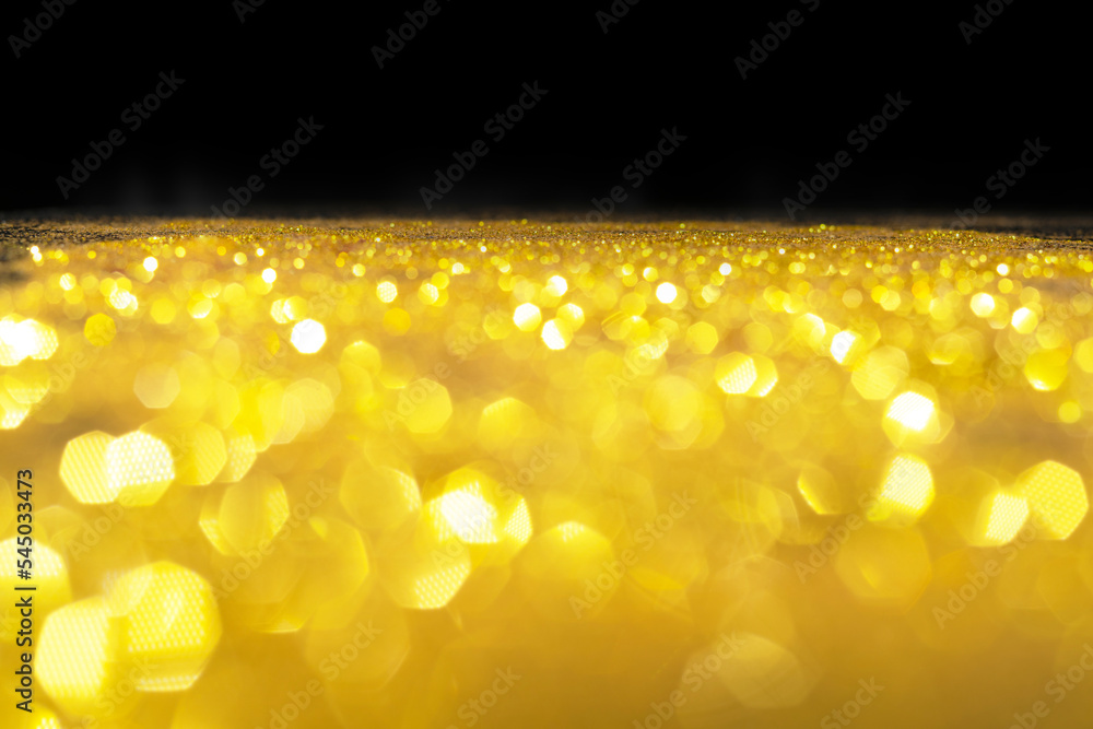 Poster abstract golden texture in blurry light for background. glitter pattern for photo effect and wallpap