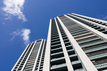 Fototapeta na wymiar Low angle of apartment building over blue sky