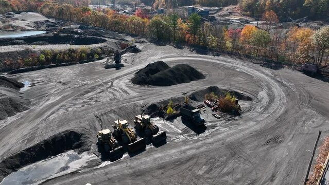 Pile of coal at mine. Aerial view of strip mine operation in rural mountains of Appalachia, USA.
