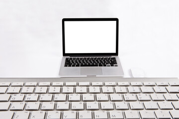 Fototapeta premium Laptop and keyboard isolated from background. You can change the background freely. communication network. silver metal surface. digital modern communication computer technology