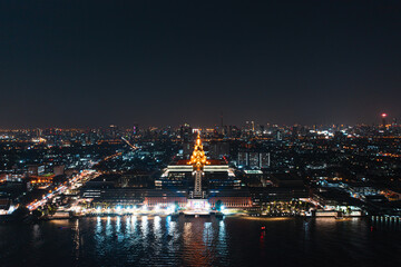 Fototapeta na wymiar Aerial view of Bangkok skyline and skyscraper with new Thai parliament, Sappaya Sapasathan (The Parliament of Thailand).National Assembly with a golden pagoda on the Chao Phraya River in Bangkok.