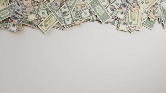 Mixed Denomination Bills Border on White Surface. Prosperity Background with copy-space.