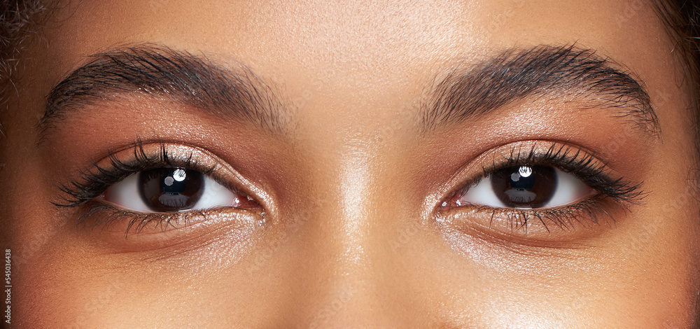 Eyes with long lash extensions (Adobe Stock comp)