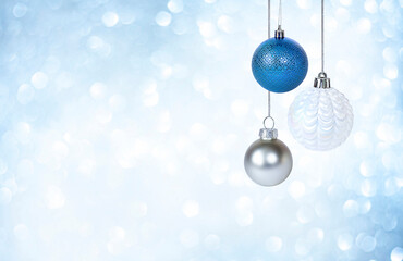 christmas ornaments on blue background with bokeh closeup