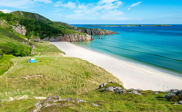 Ceannabeinne Beach and tent camping area in the summer,near Armadale,north coast of mainland Scotland,UK.