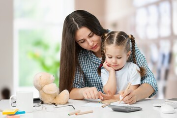 Mother and child study together at home
